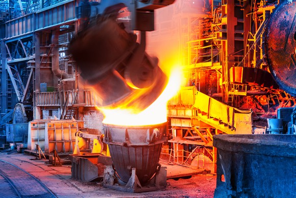 Molten steel being poured out of a huge ladle