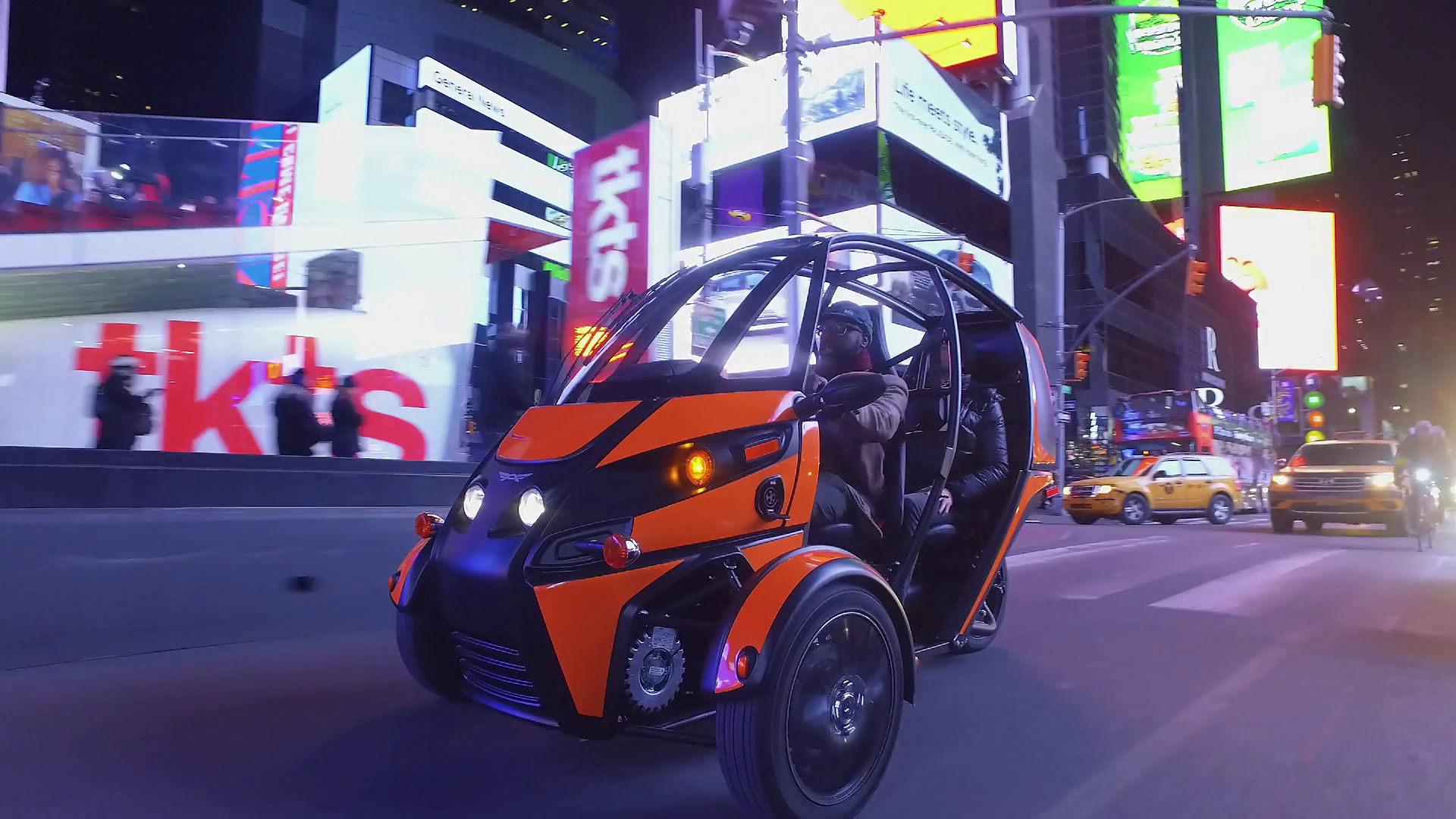 A man driving an Arcimoto FUV.