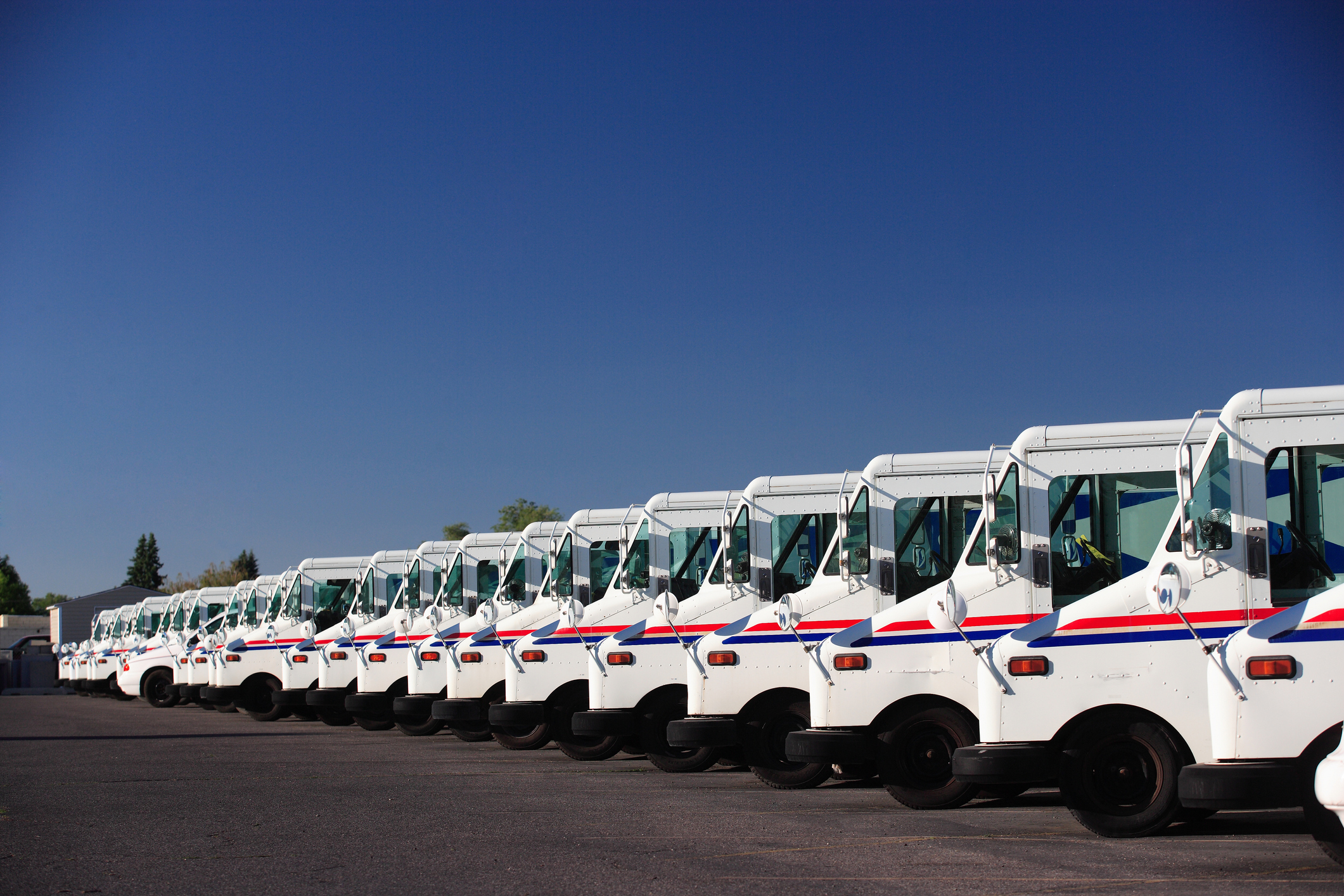 Stock photo of post office USPS vehicles source Getty