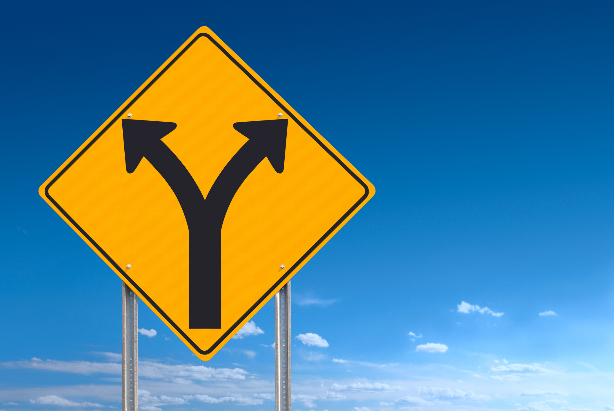 A road sign showing a diverging road ahead.