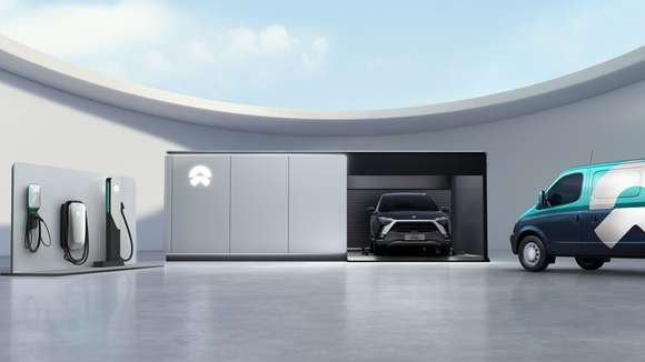 NIO power swap station with vehicle and battery chargers nearby