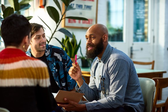 Man discussing growth strategies in a meeting. 