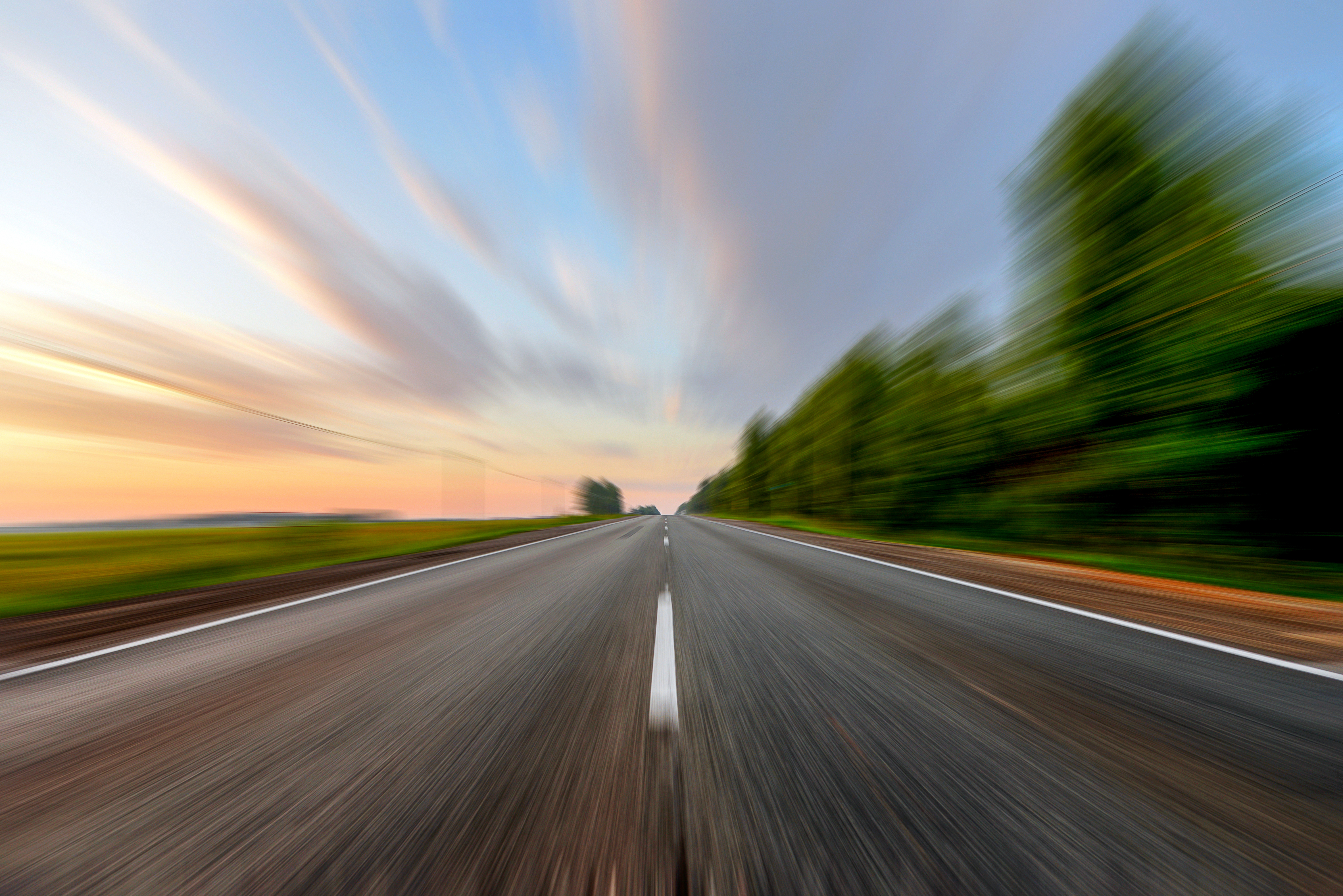 Car's-eye view of driving down the road.