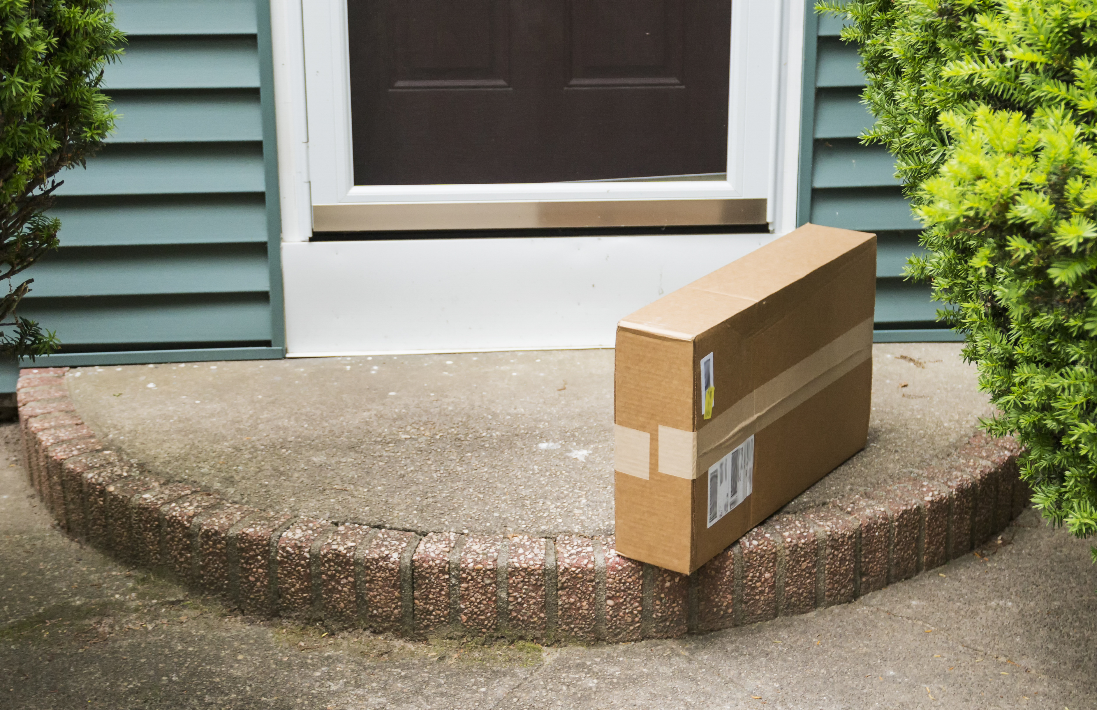 Delivered package left at front door of a home.