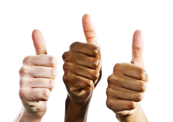 Three hands signal a thumbs up in approval.
