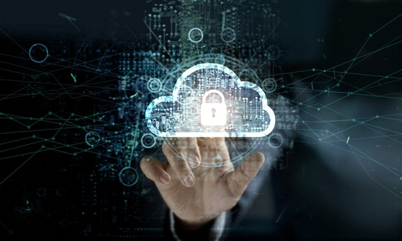 Man touching cloud with padlock icon on network connection.