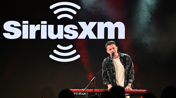 Charlie Puth performing at a Sirius XM contest.