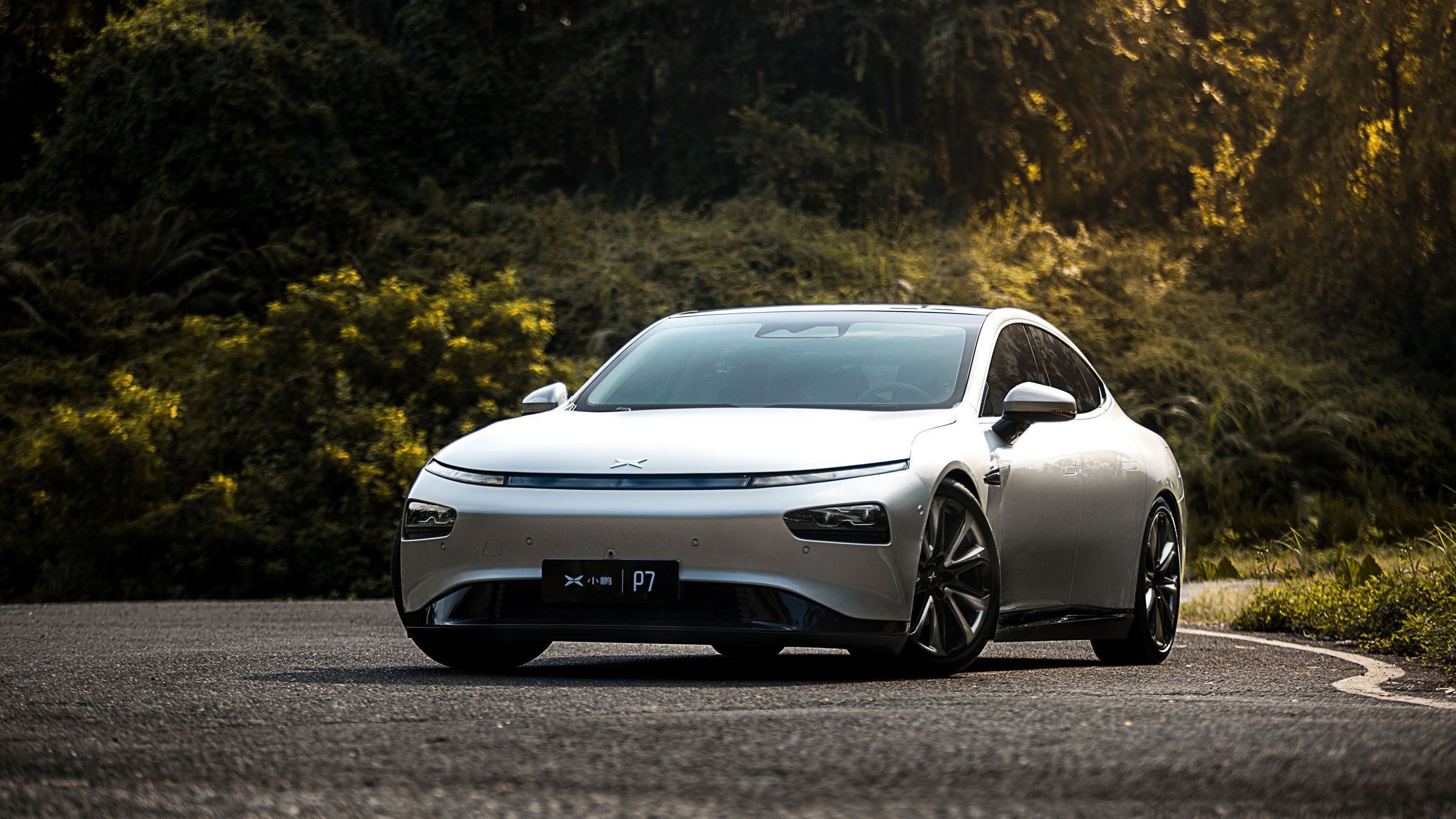 A silver Xpeng P7, a sleek electric sedan.