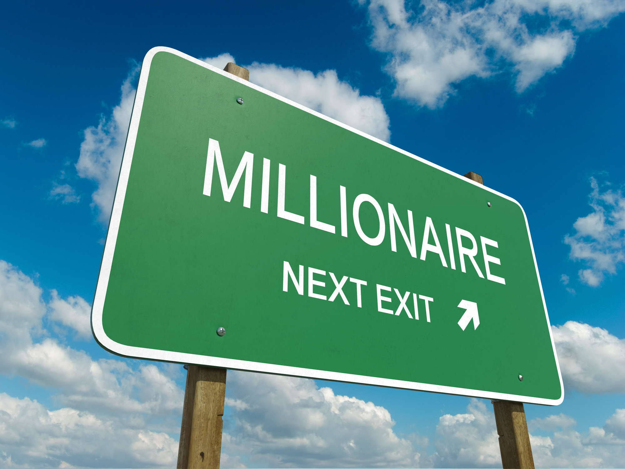 A road sign says Millionaire Next Exit.