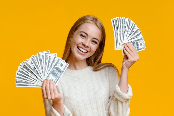 A woman holding cash