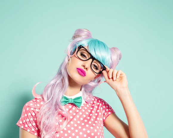 A person dressed as an anime character with dyed hair.
