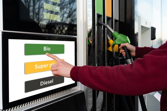 A man chooses biofuel at a self-service gas station.