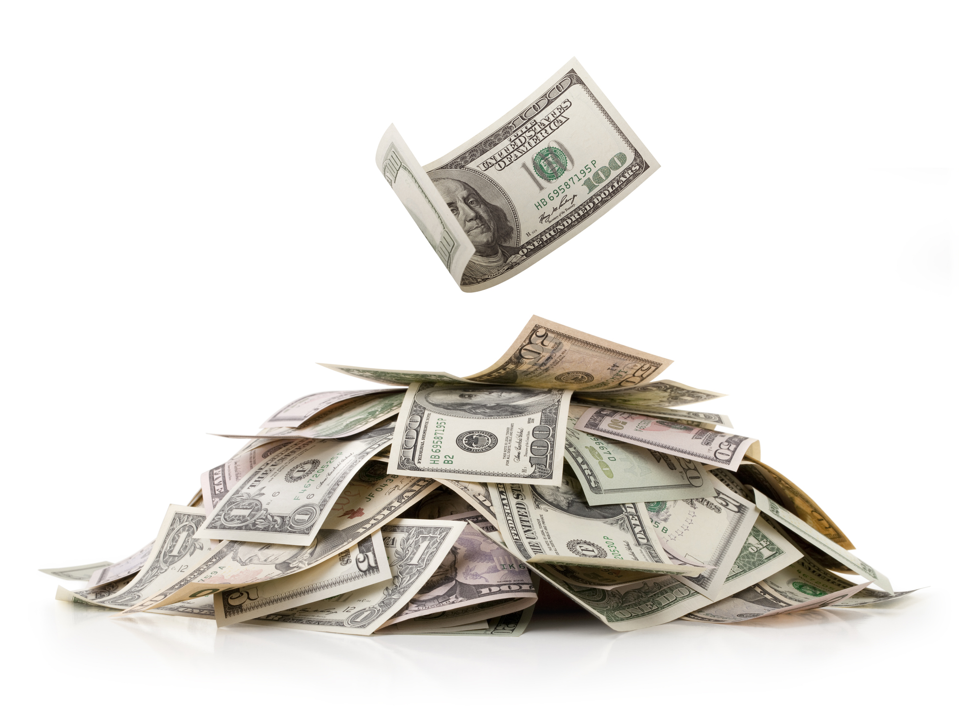A pile of loose money in all denominations, with a one hundred dollar bill floating above it.