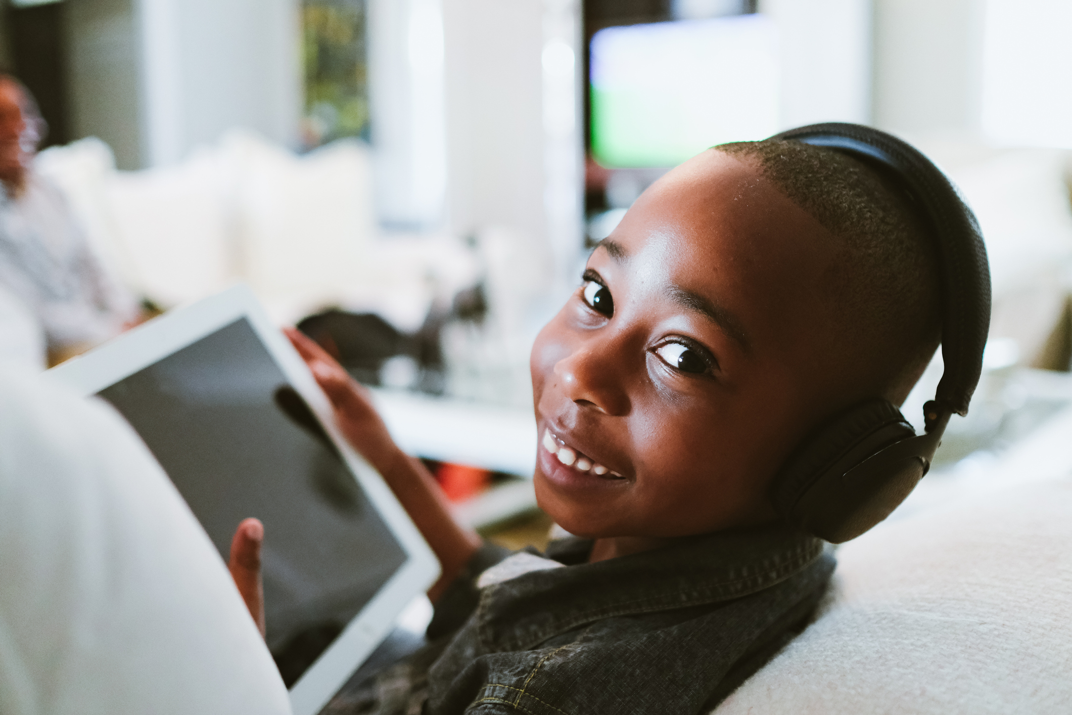 A kid on a tablet.