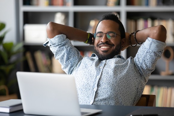 A smiling person looking relaxed. 