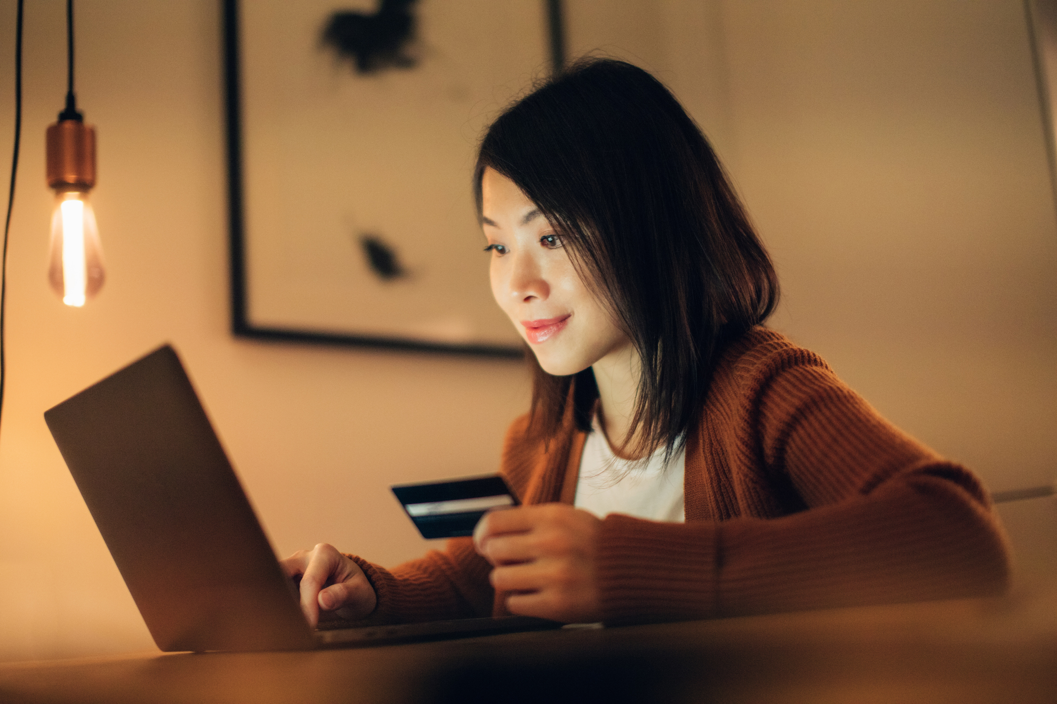 An online shopper gets ready to make a purchase on a laptop.