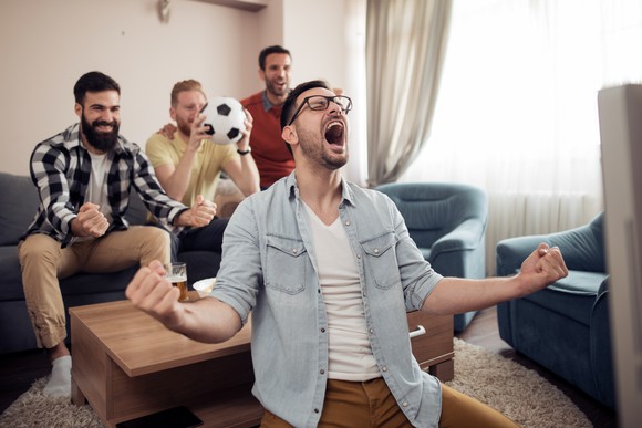Soccer fans cheering TV