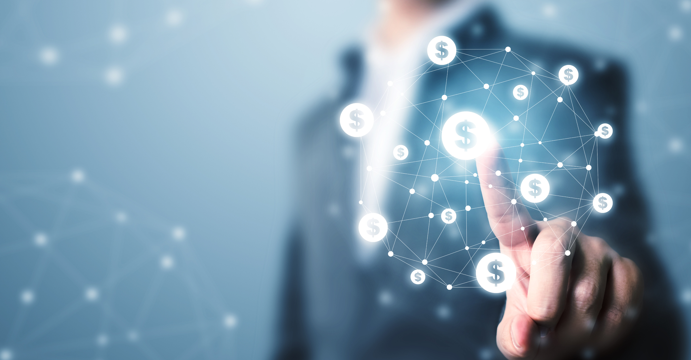 a man in a suit points to a net of dollar bill signs floating in the air