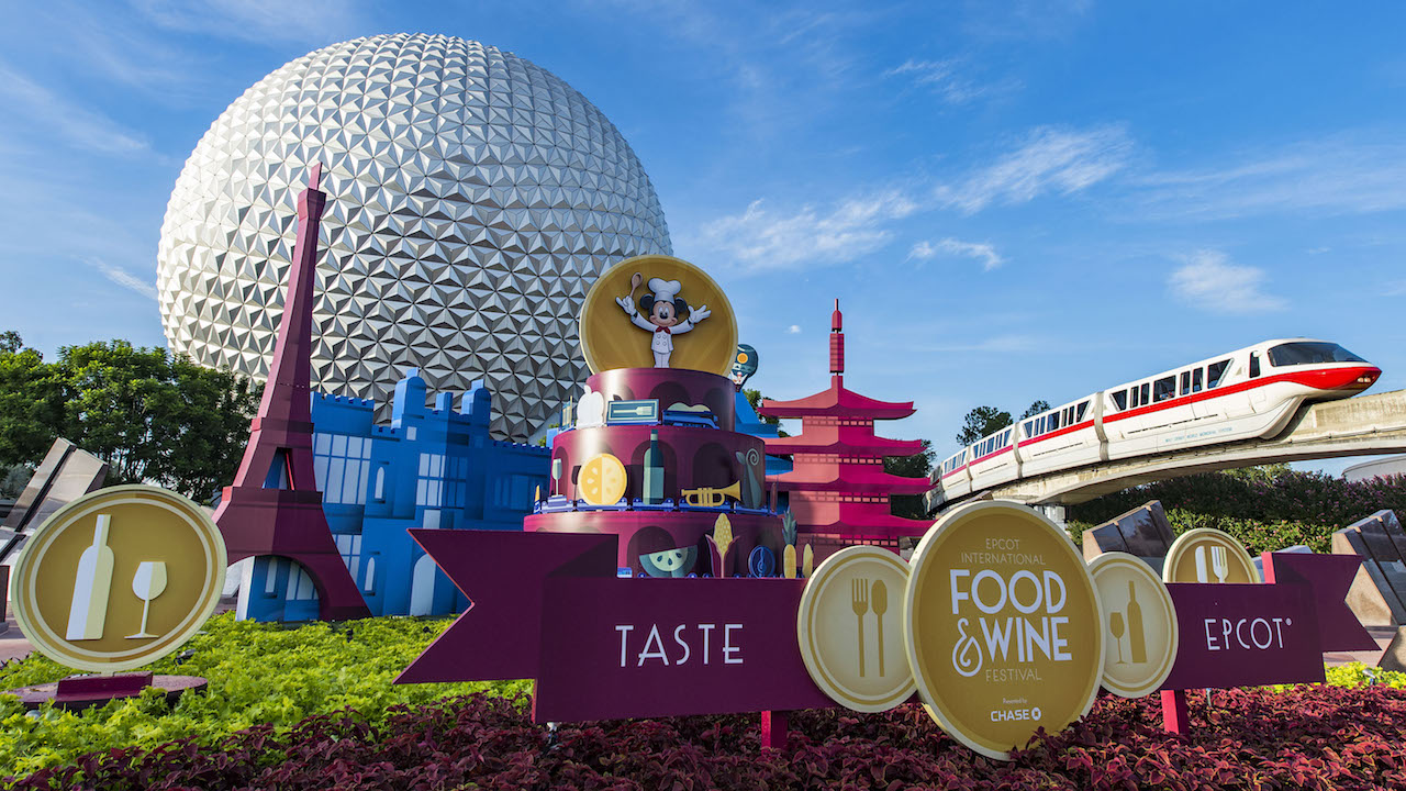 A monorail going through EPCOT during the Food & Wine Festival.