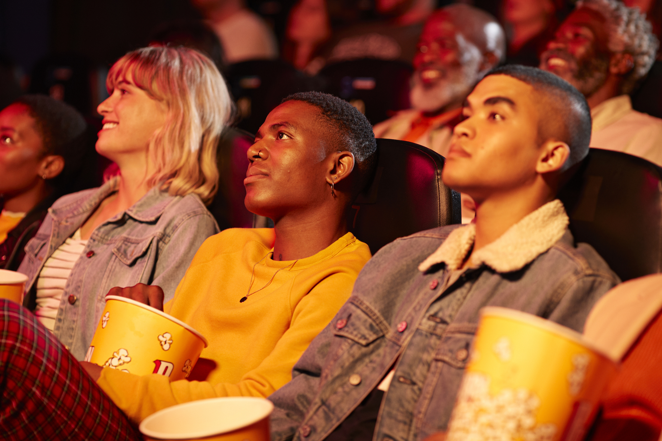 People in theater watching movie