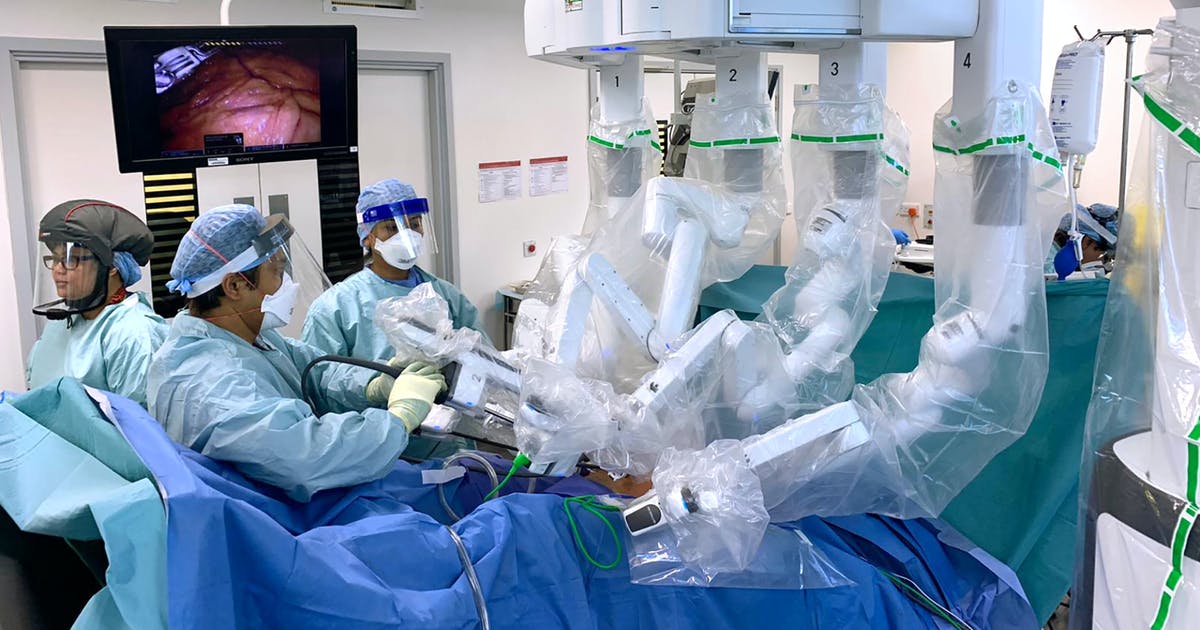 Doctors using robotic surgery system.