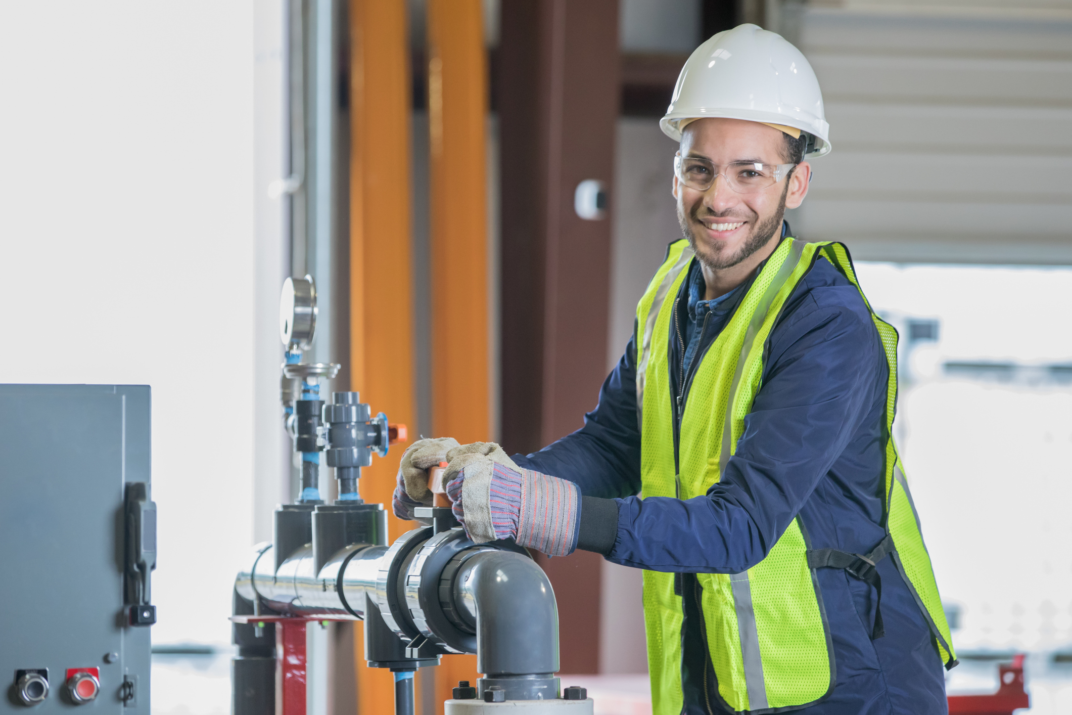 Young man working as engineer in oil and gas industry.