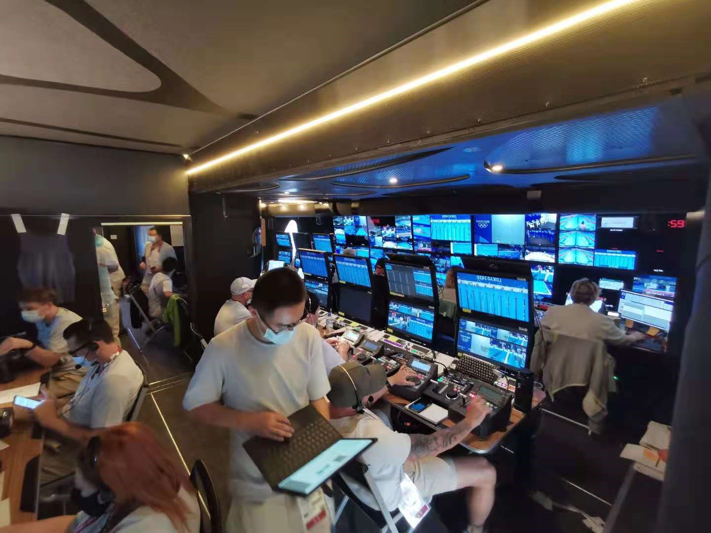 Tencent video engineers work in the broadcast booth for the 2020 Olympics.