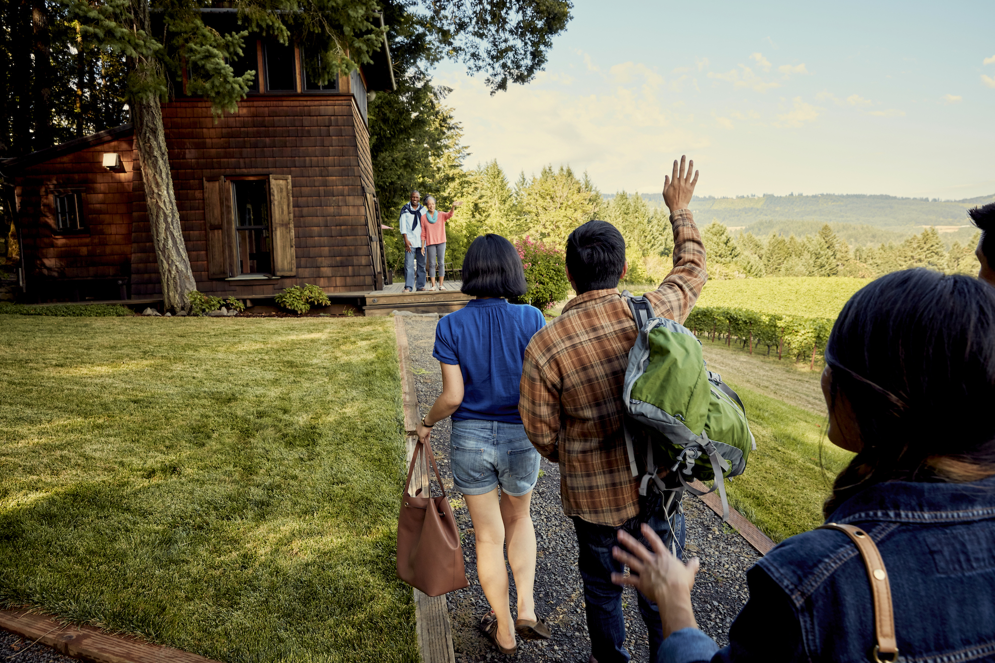 A host greets guests at an Airbnb location