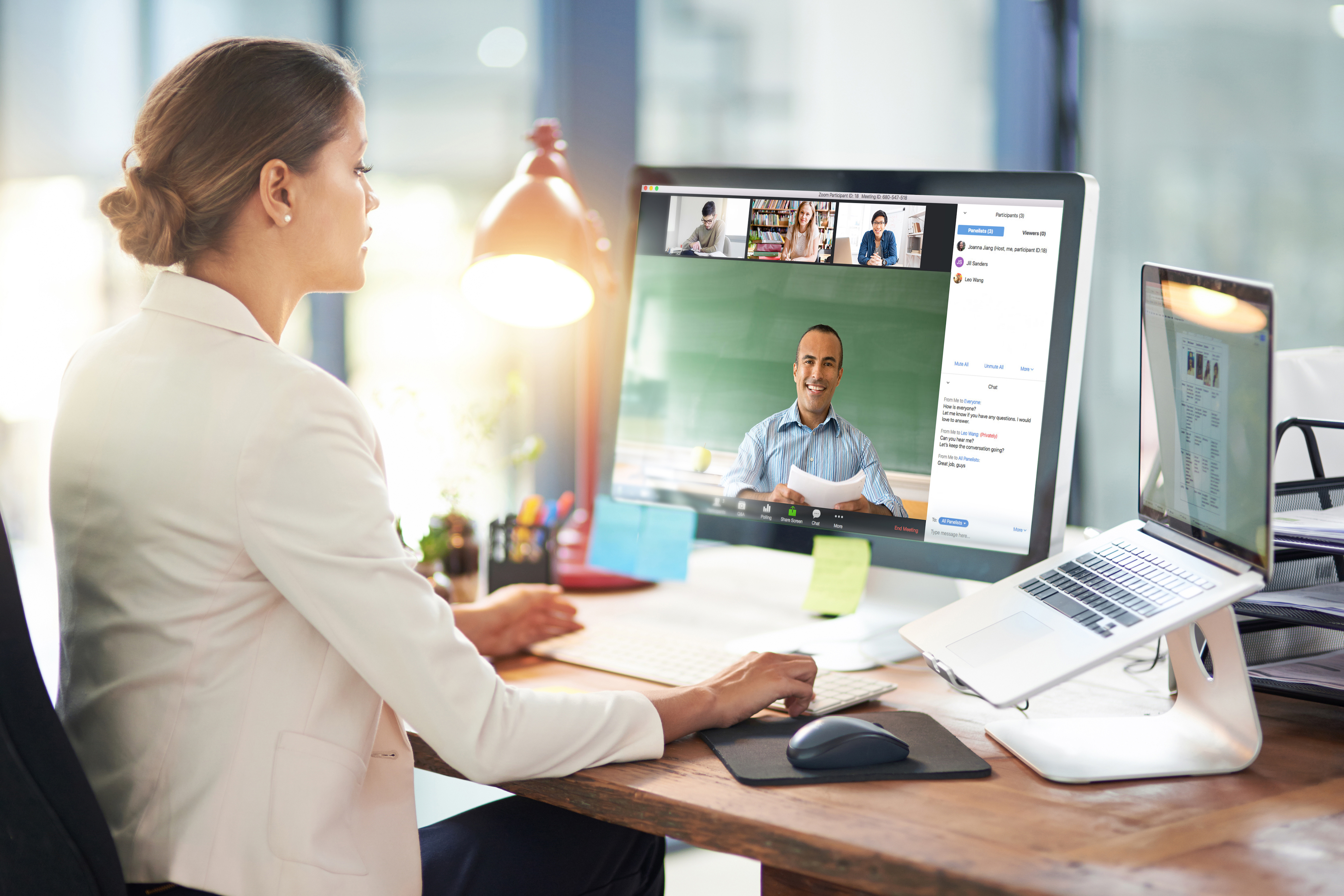 Executive engaging with colleagues through Zoom's videoconferencing platform.