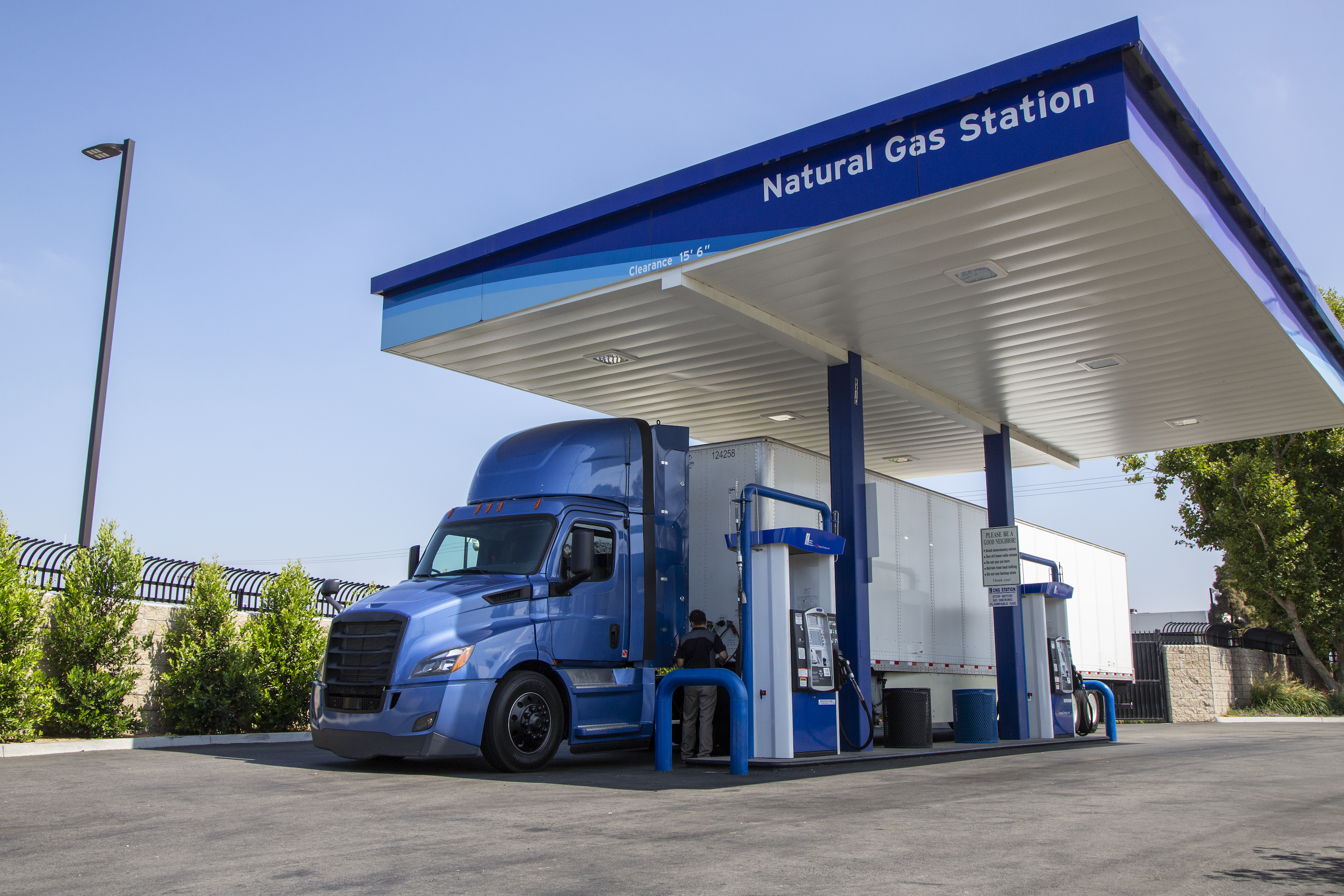 Semitrailer filling up at compressed natural gas station.