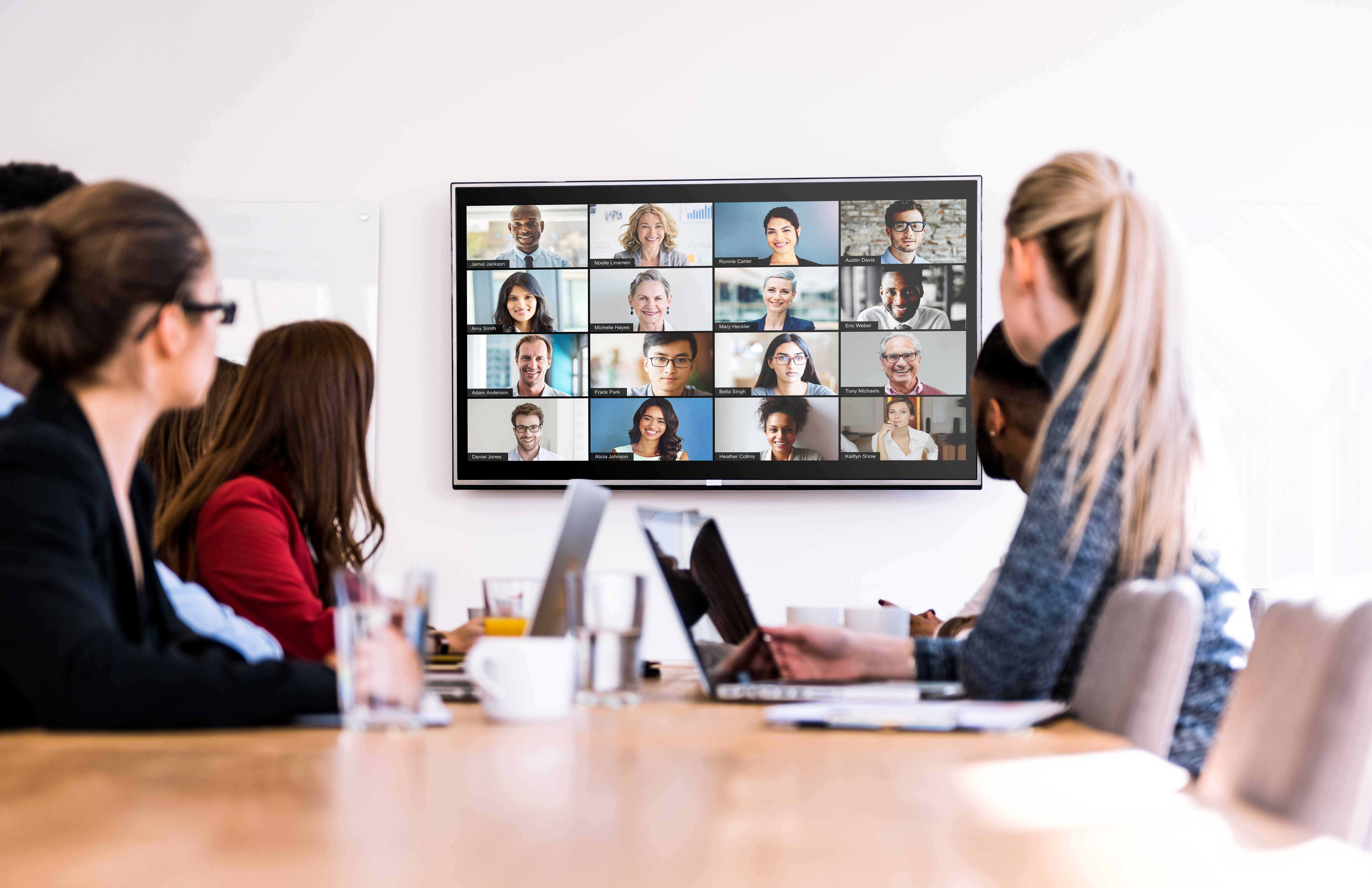 People sitting in a conference room.
