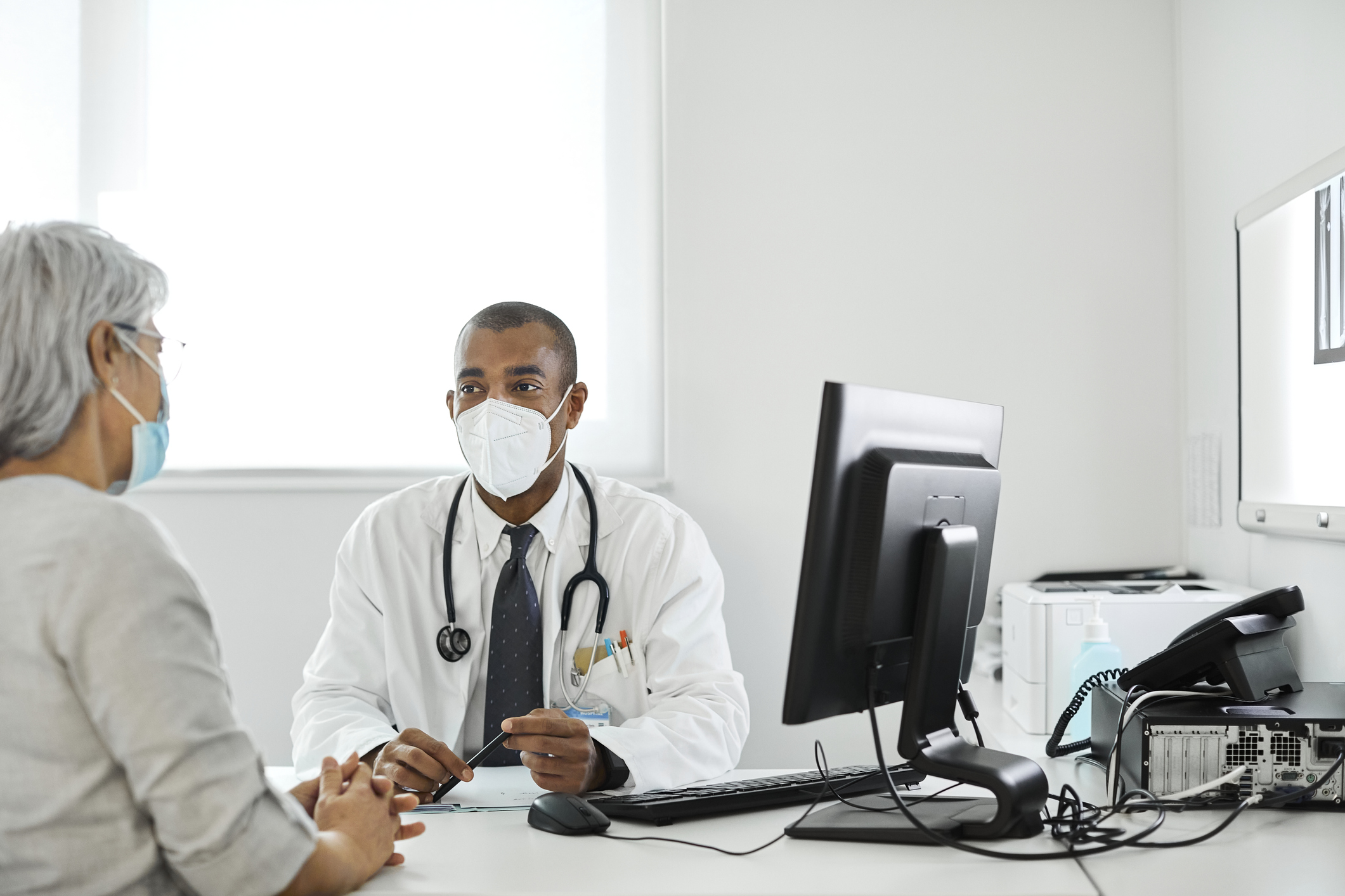 A patient meets with their doctor for an appointment.