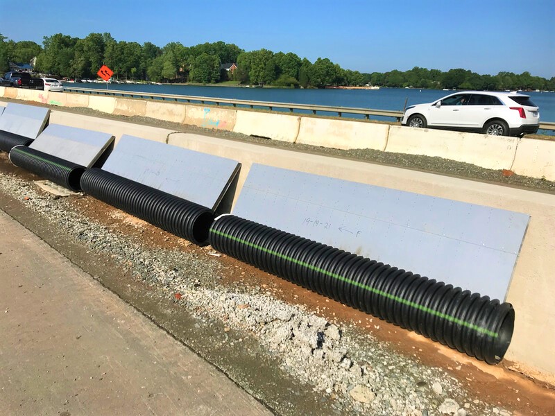 Corrugated plastic drainage piping at a highway jobsite.