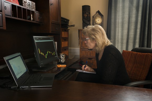 Frustrated investor checking stocks on a computer.