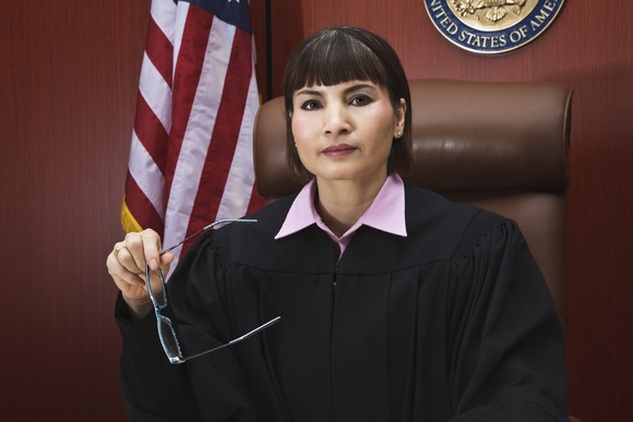 A judge sits on the bench.