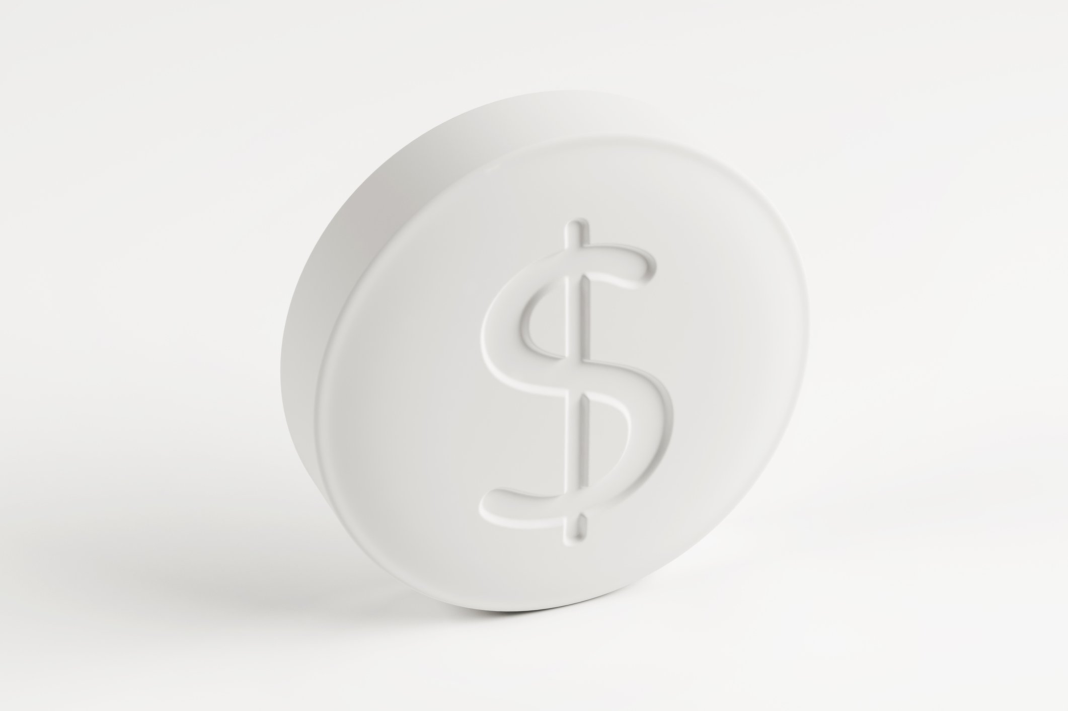 A generic white drug tablet with a dollar sign stamped onto it.