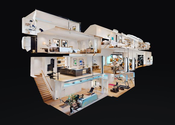 A cross section view of a dollhouse with modern design and amenities.