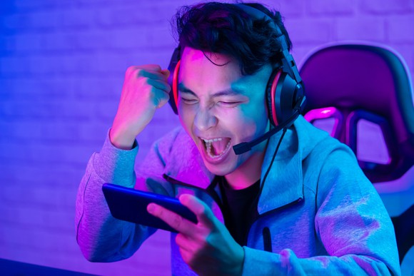 Excited gamer pumping their fist.