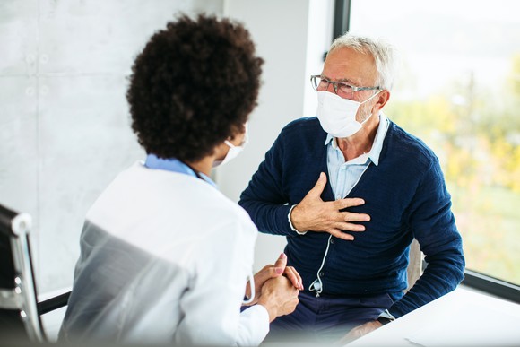 An person meets their doctor for an appointment.