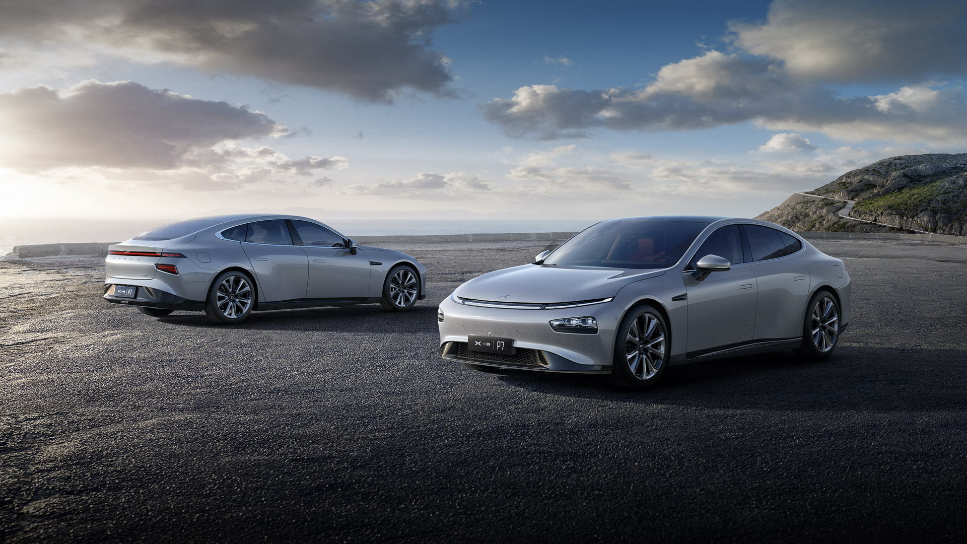 Two electric vehicles on a beach.