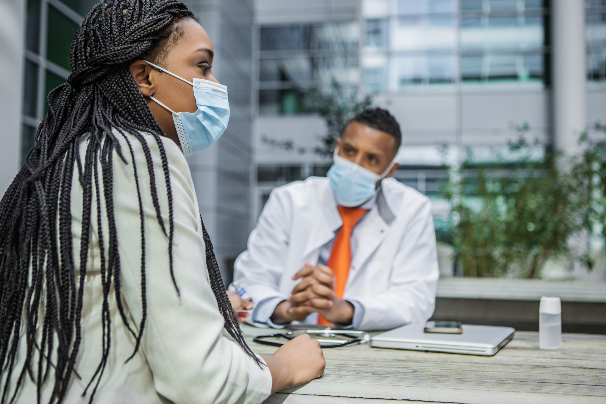 A patient meets with their doctor for an appointment.