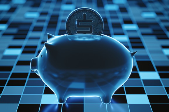 Piggy bank with a digital coin inside