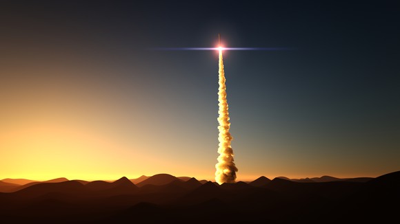 A rocket launches into space.