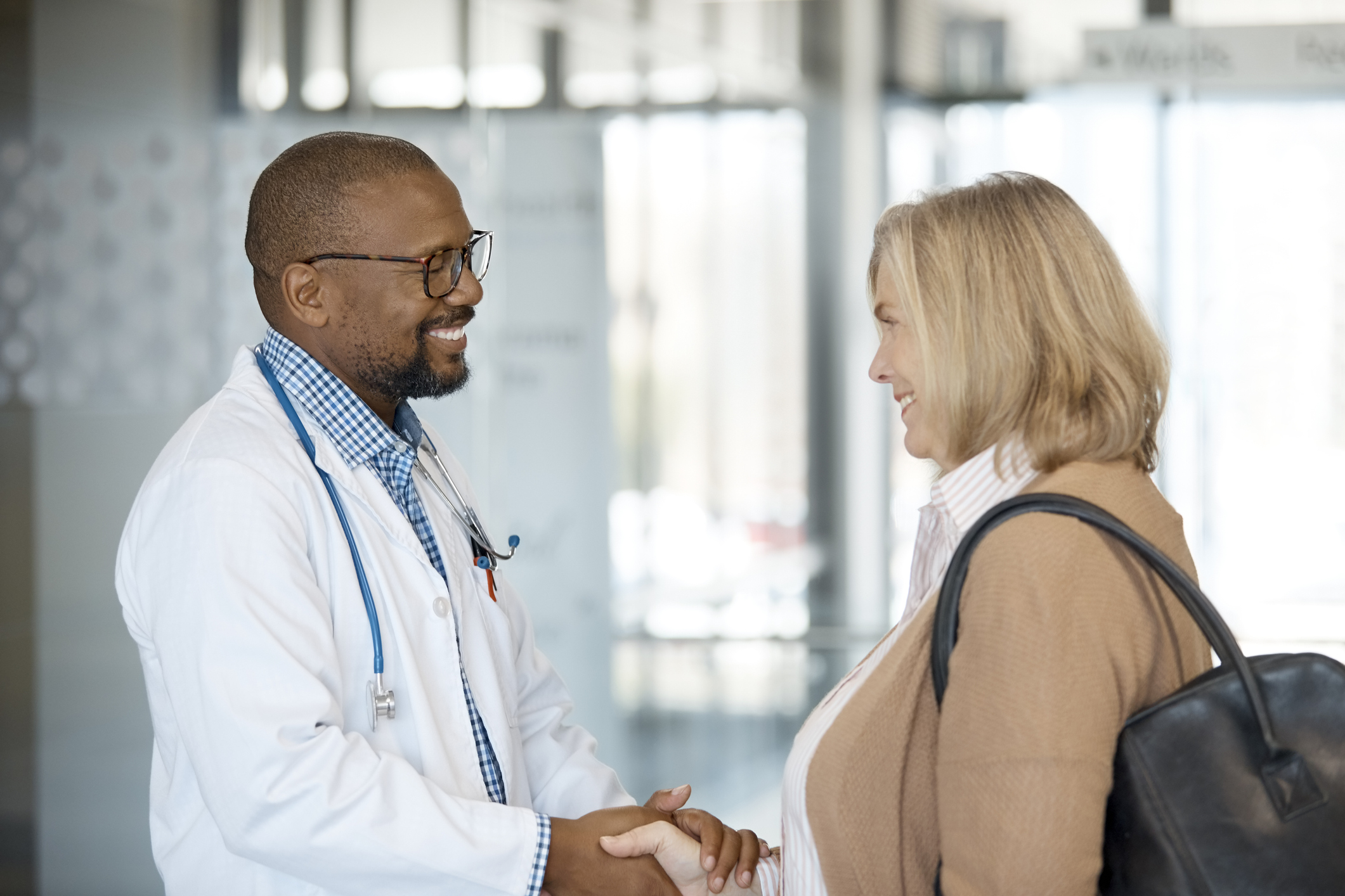Doctor shaking patient's hand.