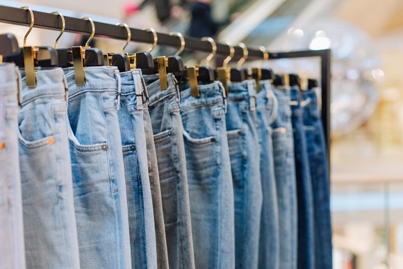 Jeans on a sales rack.
