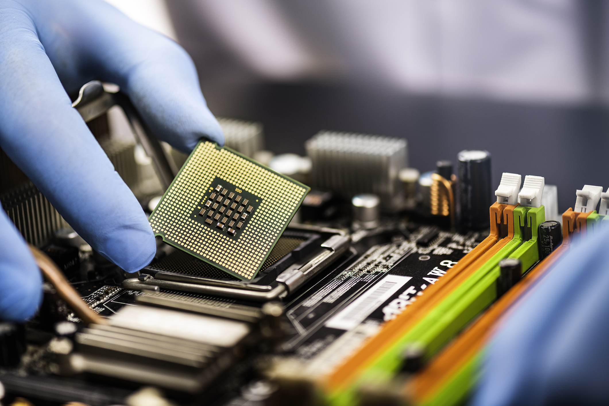 A person holding a microchip.