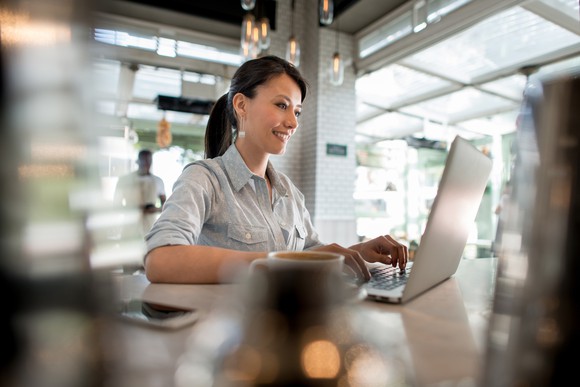 Person working on their computer in their small business,