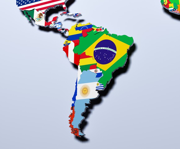 Map of Latin America overlaid with flags of each country.