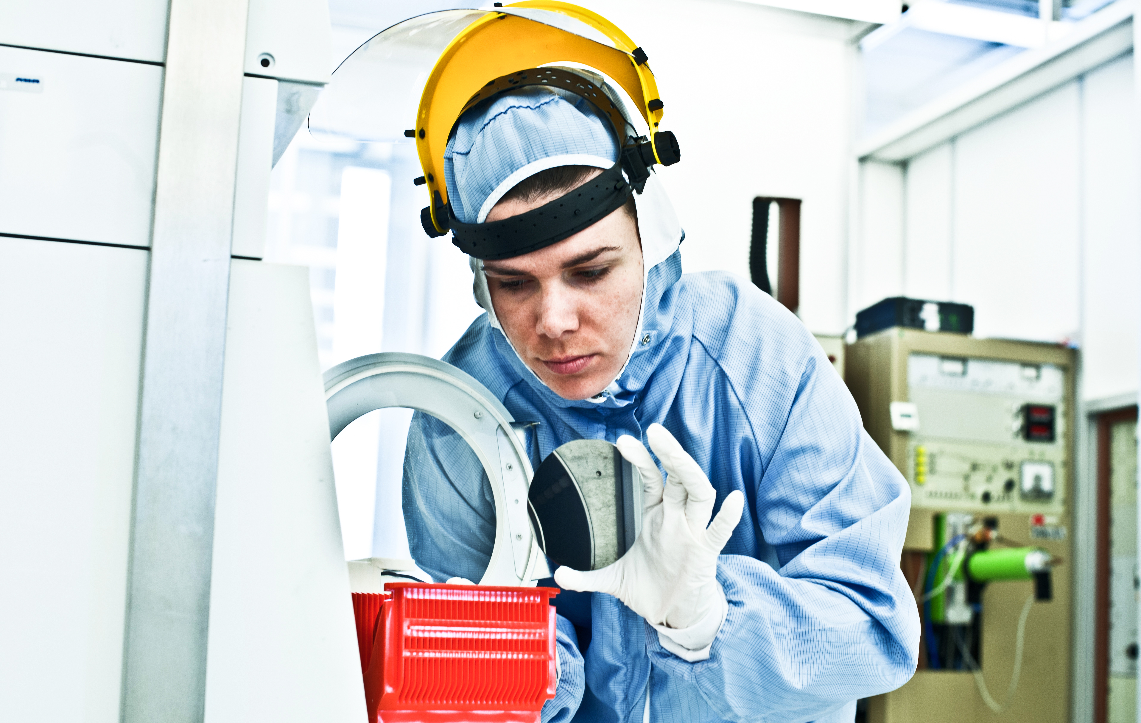 Engineer inspecting with semiconductor manufacturing process.