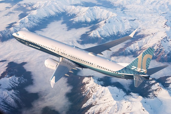 A rendering of a Boeing 737 MAX 10 flying over snow-capped mountains.